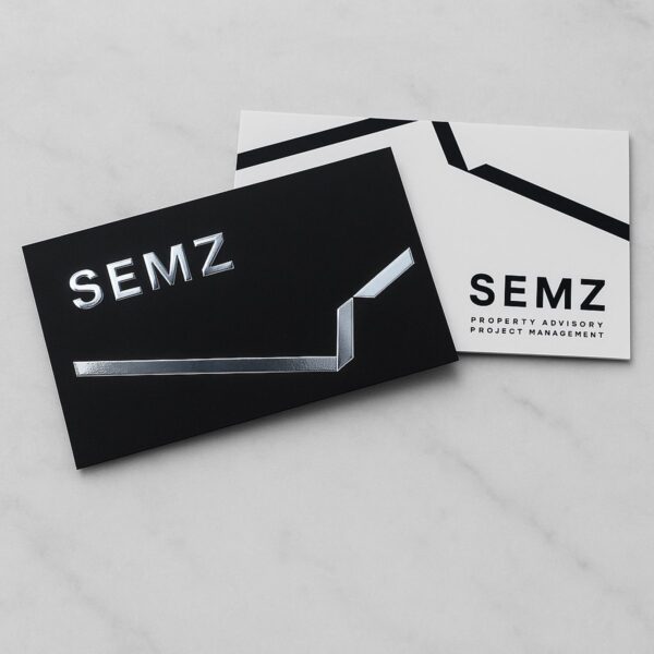 Silver foil business cards showing front and back design