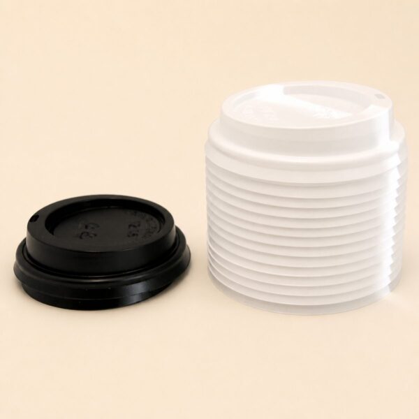 Black and white sipper lids for takeaway coffee cups