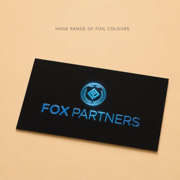 Black foil business card with electric blue foil catching the light