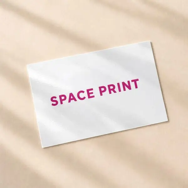 Glossy white plastic business card with magenta print
