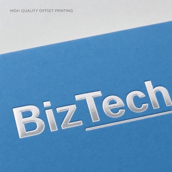 Close up macro of raised silver foil lettering on a blue business card