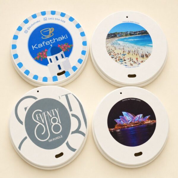 Four custom printed paper lids with different full colour designs